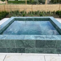 a green marble outdoor custom spa